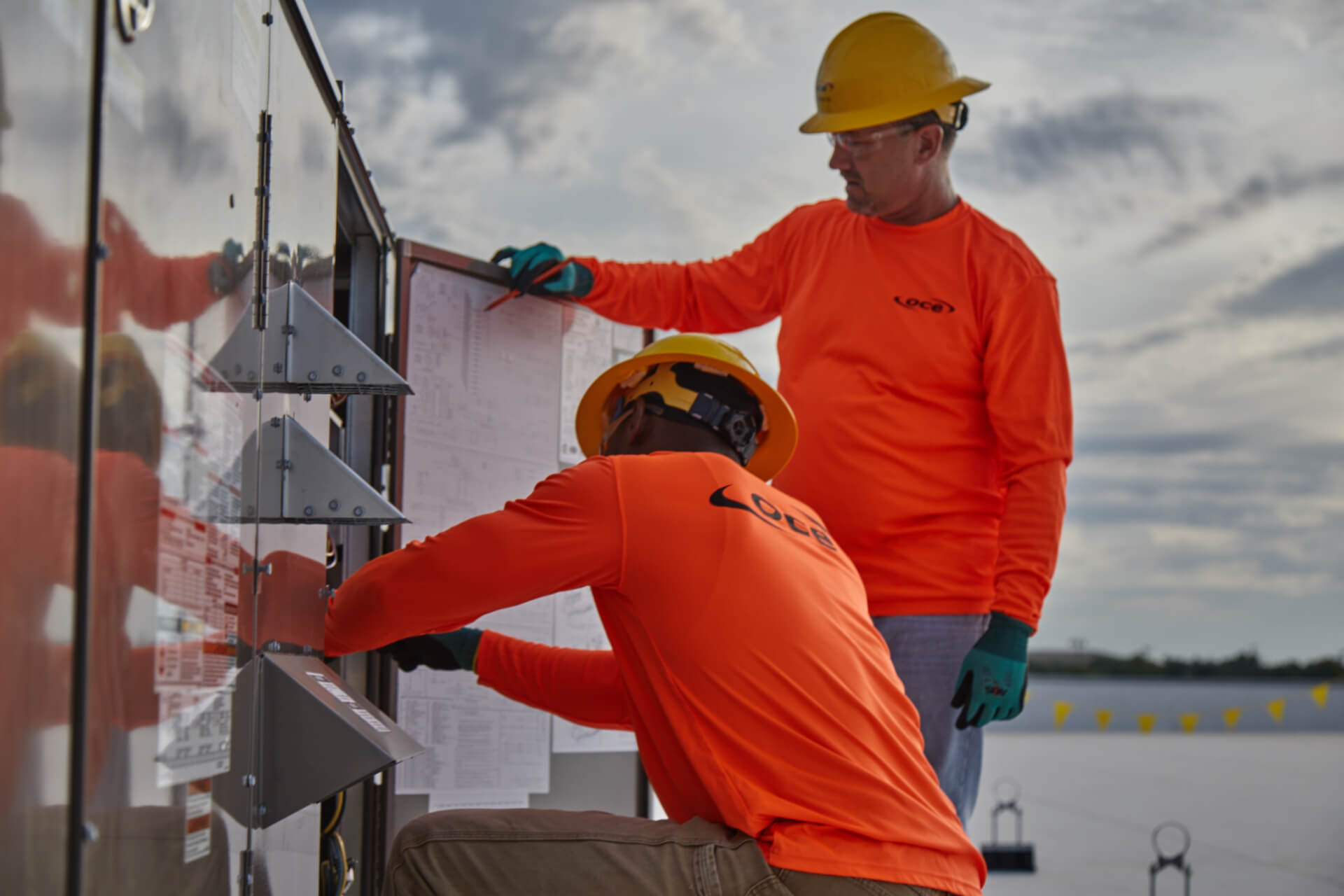 workers working in an electrical box